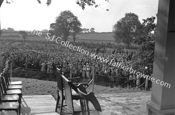 PILGRIM CROWDS ON BANKS OF STIFFKEY FROM ALTAR PLATFORM